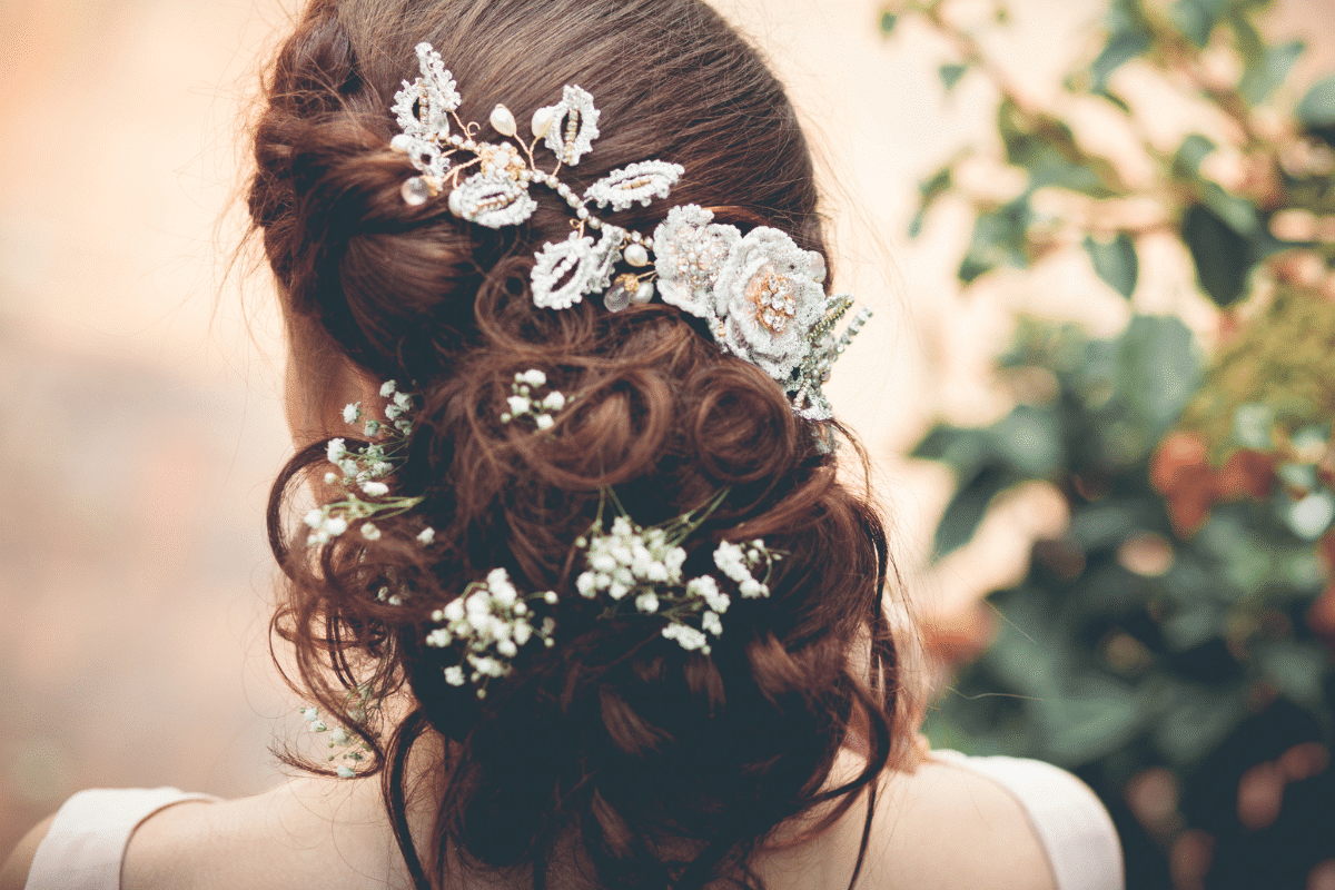 Hair Styling 1 Back of a brides hair with flowers in it.