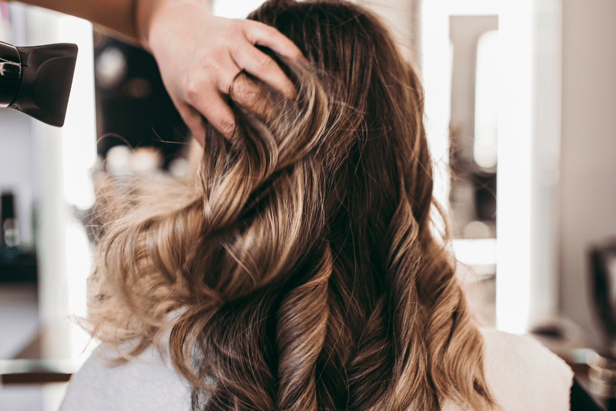 Hair Styling 3 Woman with blond highlights having her hair styled for a Quinceañera