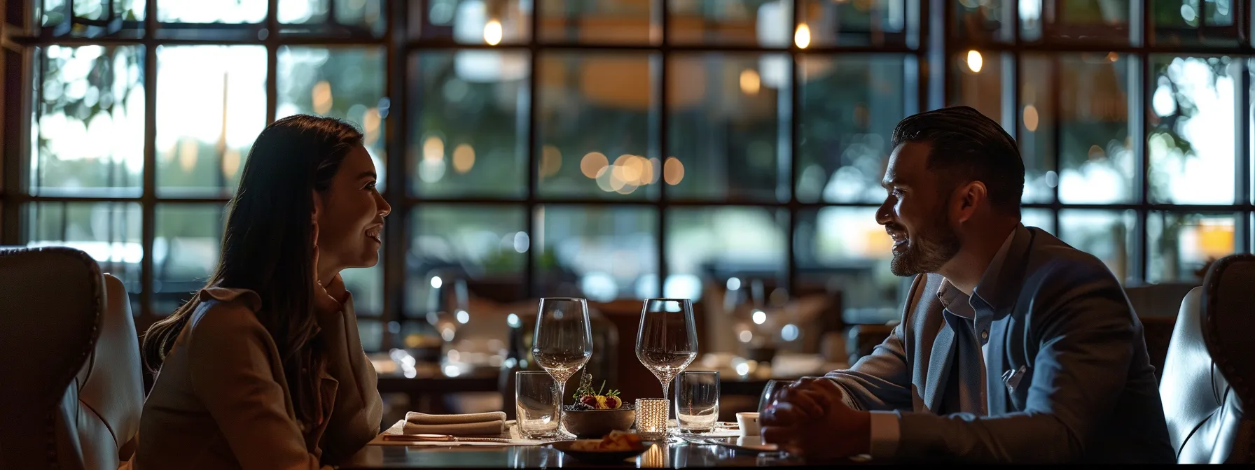 a couple enjoying a romantic dinner at an upscale restaurant in north dallas.