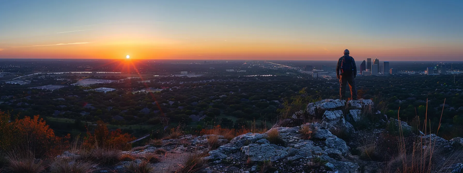 Unveiling Secret Hiking Trails in North Dallas 5 a hiker standing at the edge of sunset ridge, admiring the breathtaking panoramic views of north dallas.